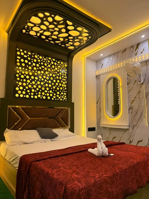 Luxury houseboat bedroom with designer gold-lit canopy